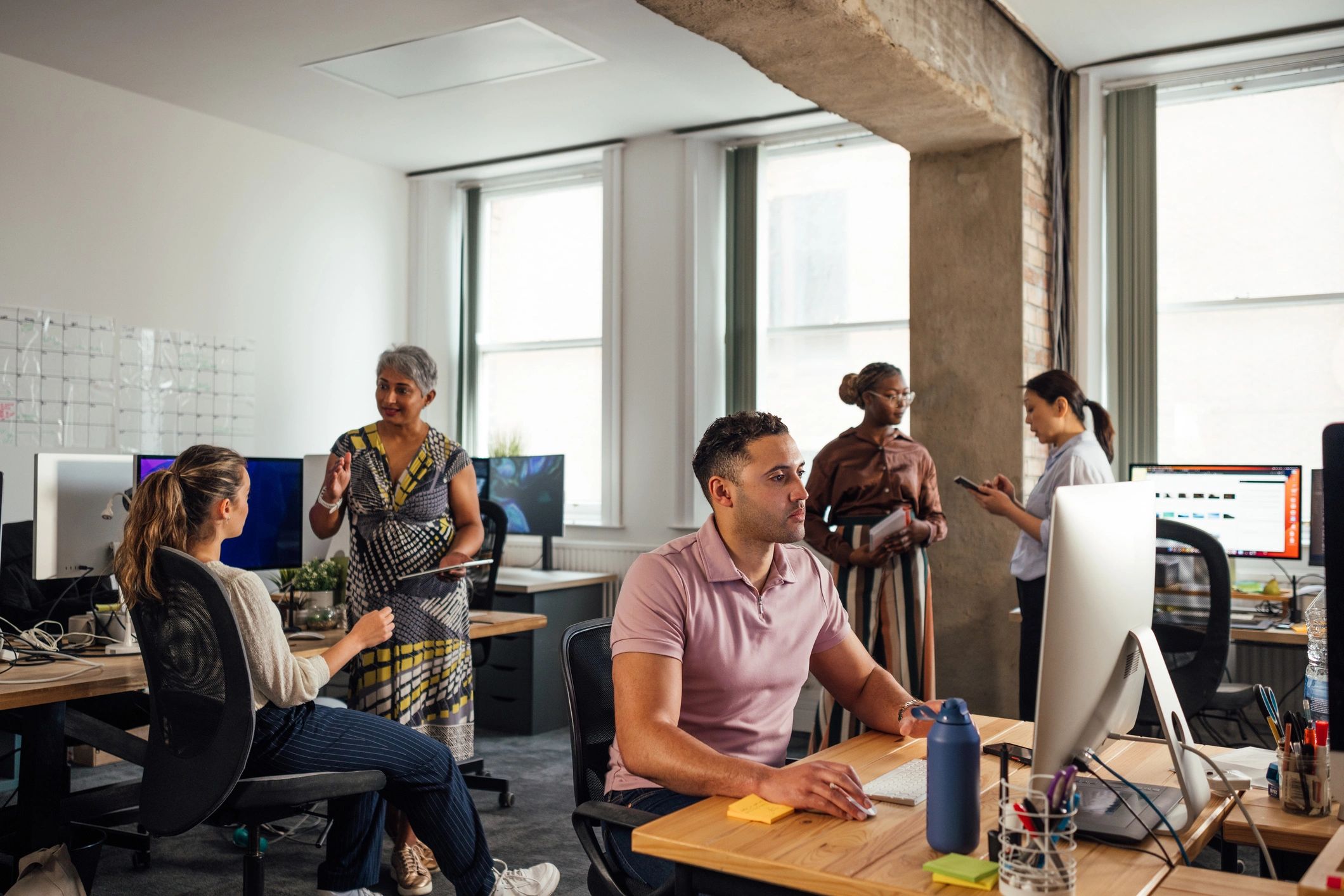 Team collaborating in a modern office on website and marketing projects
