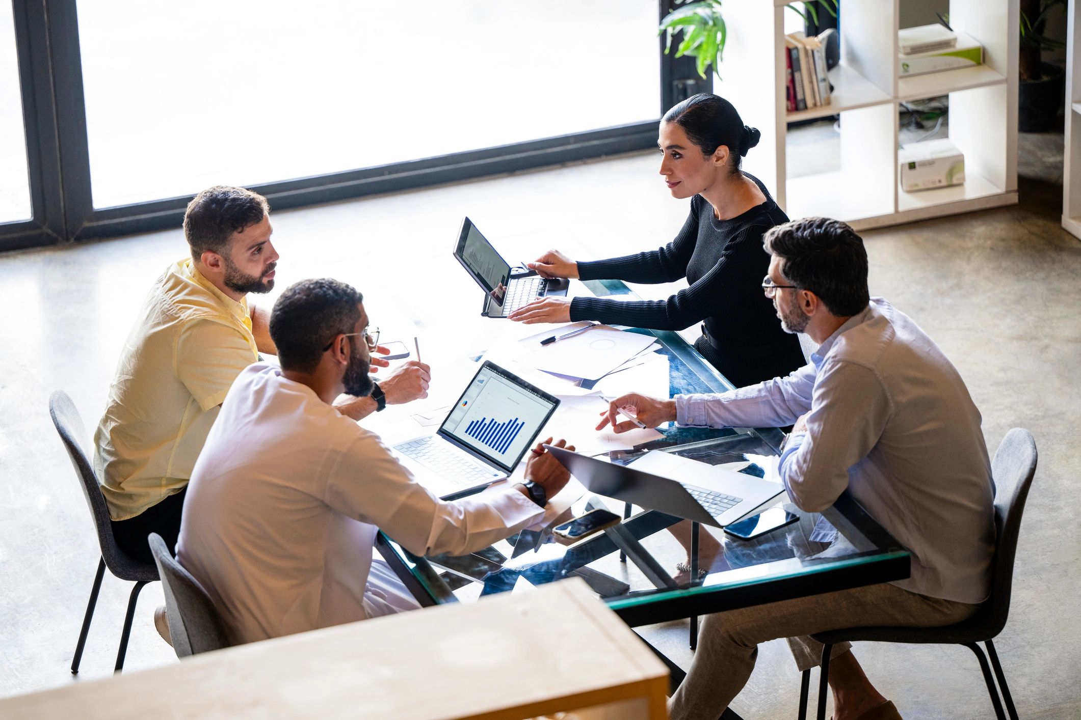 Company founder working with colleagues in a meeting